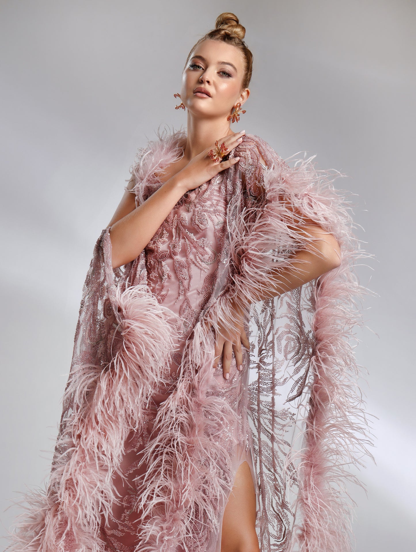 Elegant evening dress with asymmetric embroidery and feather detailing – Biana